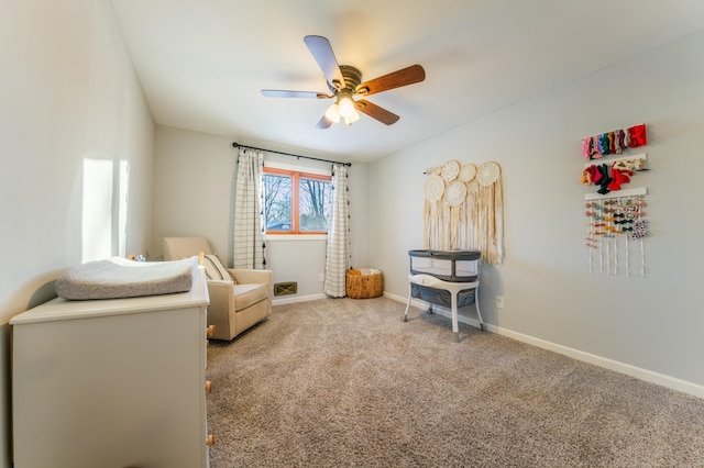 living area featuring ceiling fan and carpet floors