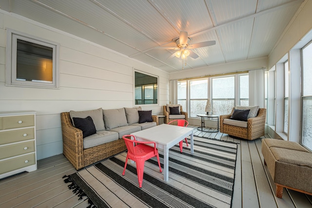 sunroom featuring ceiling fan