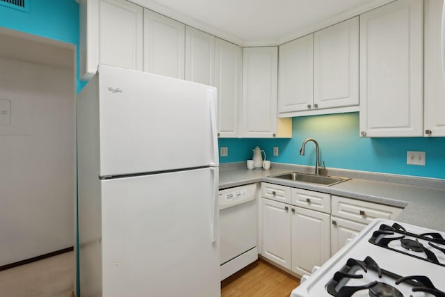 kitchen featuring white appliances, light hardwood / wood-style flooring, white cabinetry, and sink