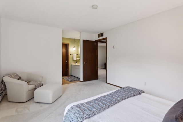 bedroom with carpet and ensuite bathroom