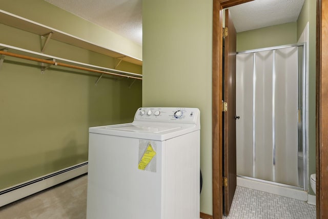 laundry area with washer / clothes dryer, a baseboard radiator, and a textured ceiling