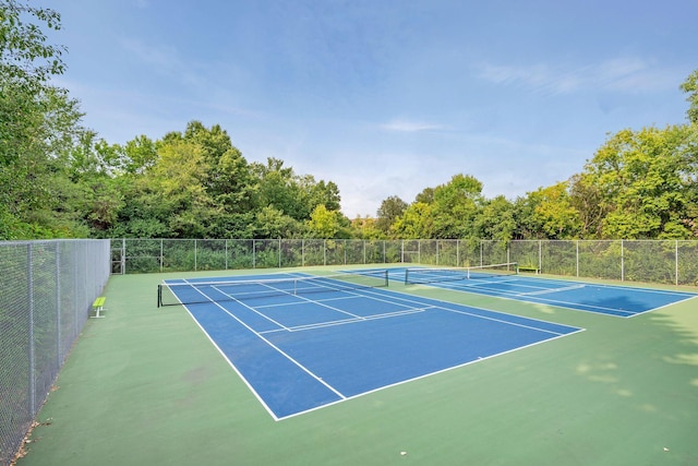 view of tennis court featuring basketball court