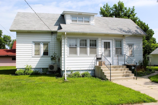 bungalow with a front yard