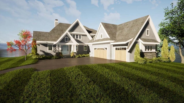 craftsman house featuring a garage and a front yard