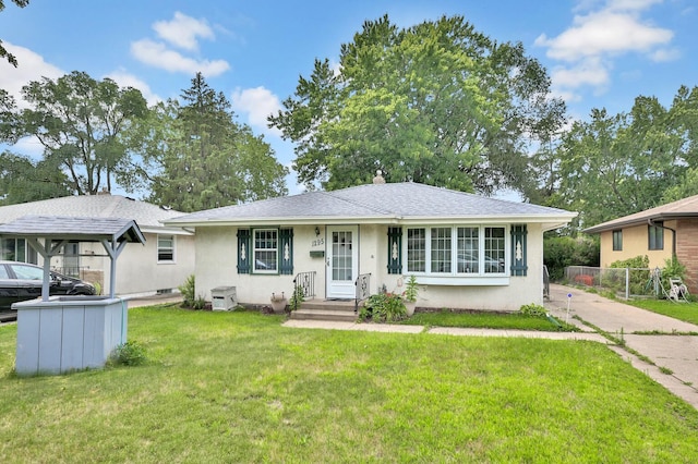 ranch-style house featuring a front yard