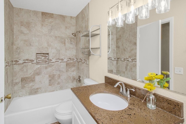 full bathroom with vanity, toilet, and tiled shower / bath combo