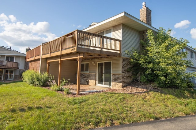 rear view of property with a yard