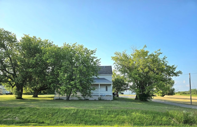 view of home's exterior with a yard