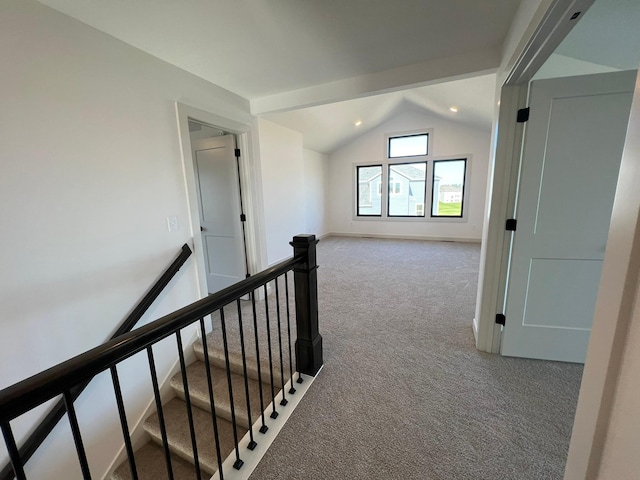 interior space with lofted ceiling, carpet floors, an upstairs landing, and recessed lighting