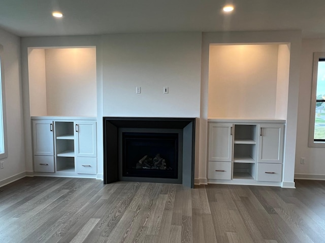 unfurnished living room with hardwood / wood-style flooring