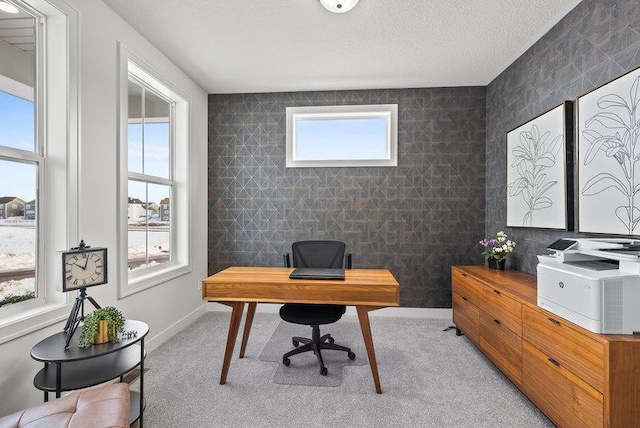 home office with light carpet, a textured ceiling, tile walls, and baseboards