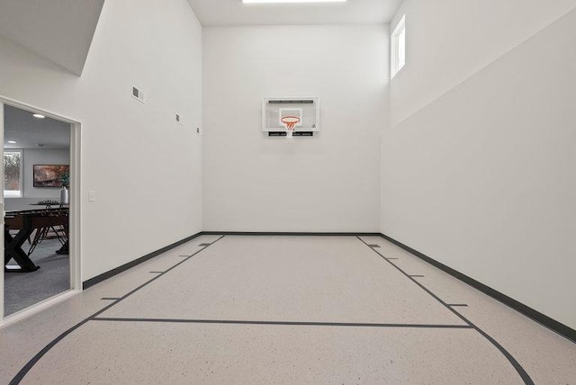 view of sport court featuring basketball hoop