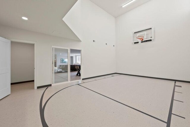 view of sport court with basketball hoop