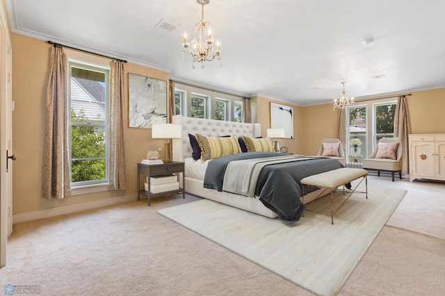 carpeted bedroom with crown molding and an inviting chandelier