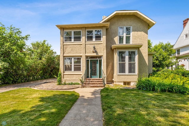 view of front of property with a front lawn