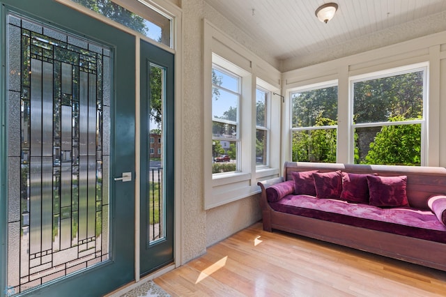 sunroom featuring wood ceiling