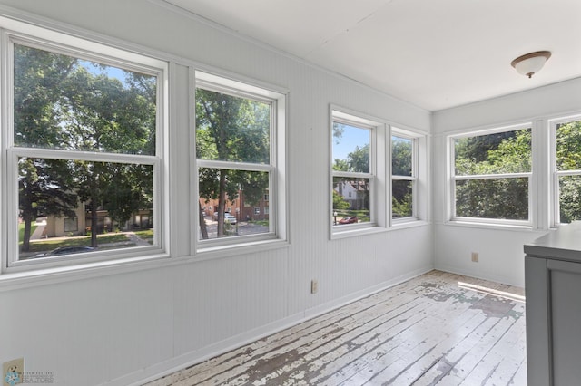 unfurnished sunroom featuring a wealth of natural light