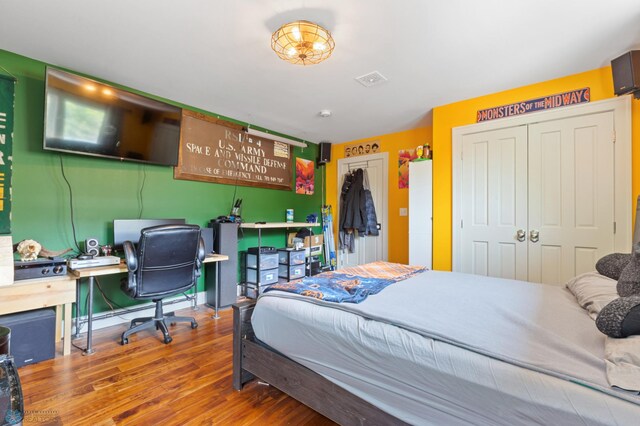 bedroom with wood-type flooring