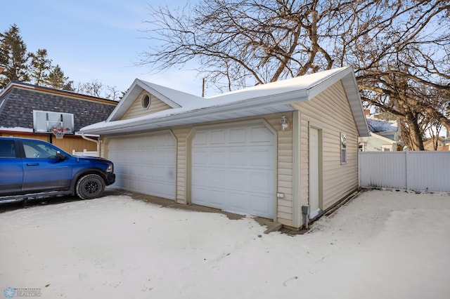 view of snow covered garage