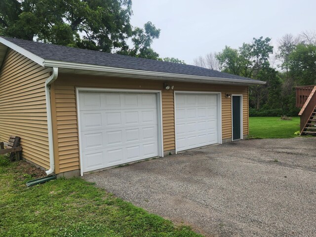 garage with a yard