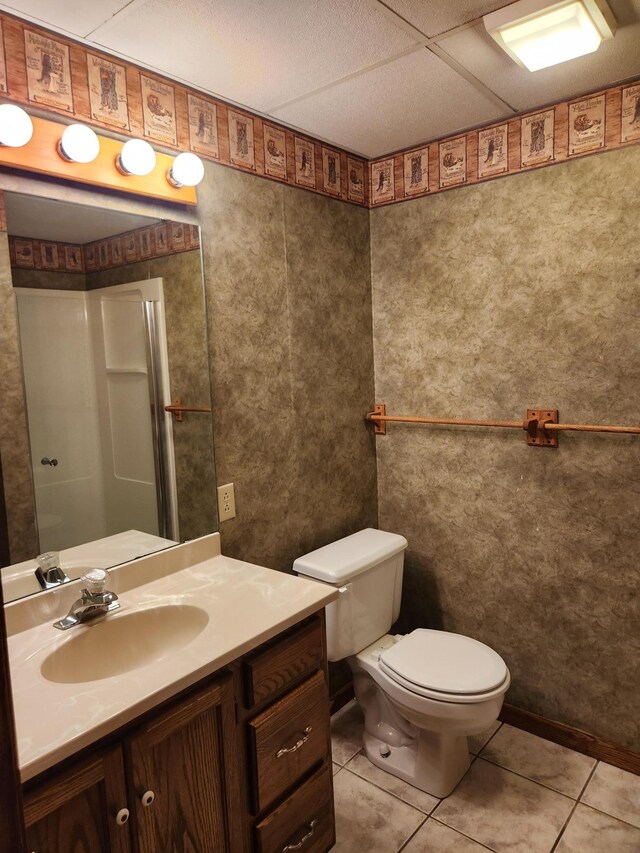 bathroom featuring tile patterned floors, vanity, and toilet