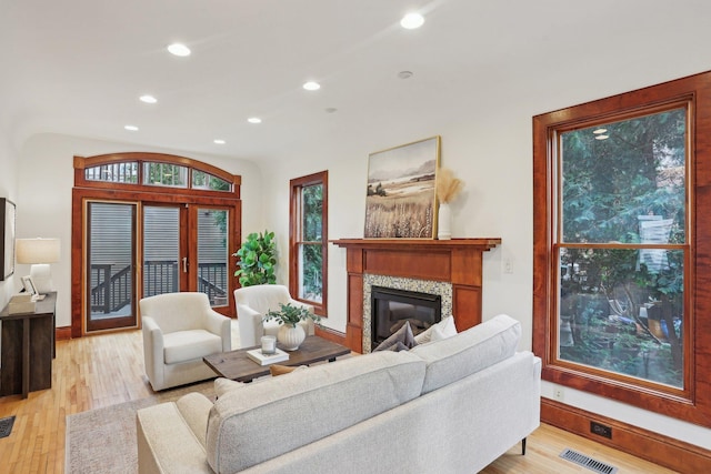 2410 Irving Ave S, Minneapolis, MN 55405 - living room with recessed lighting, a fireplace, light wood-type flooring, and baseboards