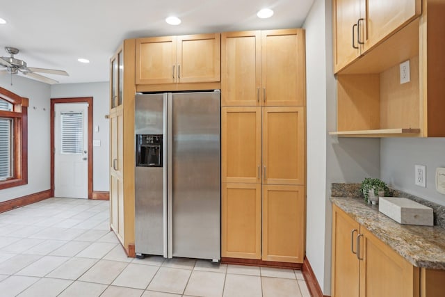 2410 Irving Ave S, Minneapolis, MN 55405 - kitchen featuring stainless steel fridge with ice dispenser, recessed lighting, ceiling fan, stone counters, and baseboards