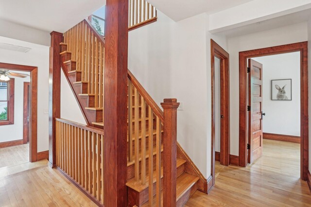 2410 Irving Ave S, Minneapolis, MN 55405 - staircase with wood finished floors, baseboards, and ceiling fan