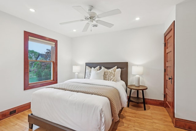 2410 Irving Ave S, Minneapolis, MN 55405 - bedroom with light wood-type flooring, baseboards, recessed lighting, and ceiling fan