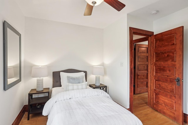 2410 Irving Ave S, Minneapolis, MN 55405 - bedroom with light wood-style flooring, ceiling fan, and baseboards