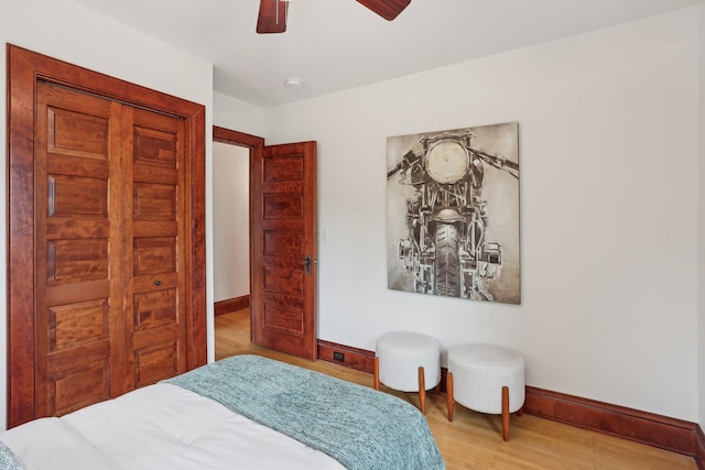 2410 Irving Ave S, Minneapolis, MN 55405 - bedroom featuring baseboards, wood finished floors, and ceiling fan