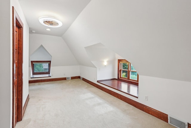 2410 Irving Ave S, Minneapolis, MN 55405 - additional living space featuring carpet, lofted ceiling, and baseboards