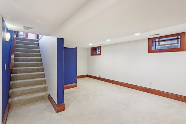 2410 Irving Ave S, Minneapolis, MN 55405 - below grade area with carpet, baseboards, stairs, and recessed lighting