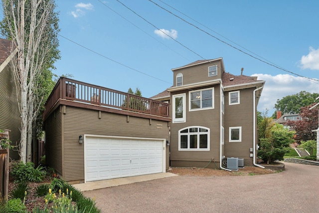 2410 Irving Ave S, Minneapolis, MN 55405 - view of front of property featuring a balcony, asphalt driveway, and a garage