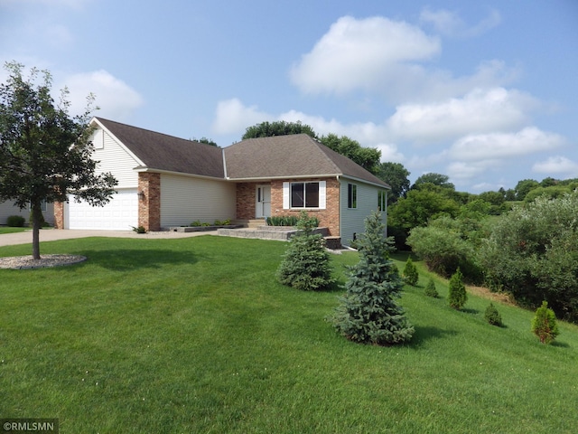 ranch-style house with brick siding, an attached garage, driveway, and a front lawn