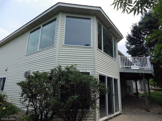 view of side of property with a deck