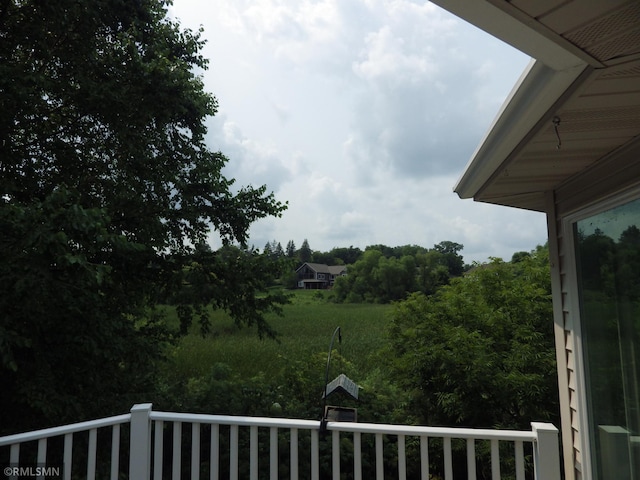 view of yard featuring a balcony