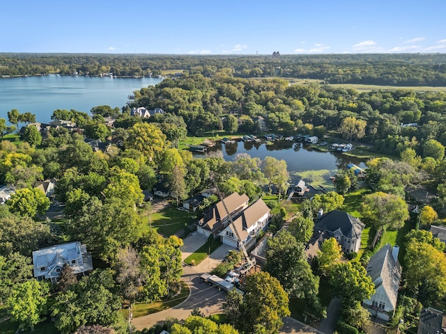 aerial view featuring a water view and a view of trees