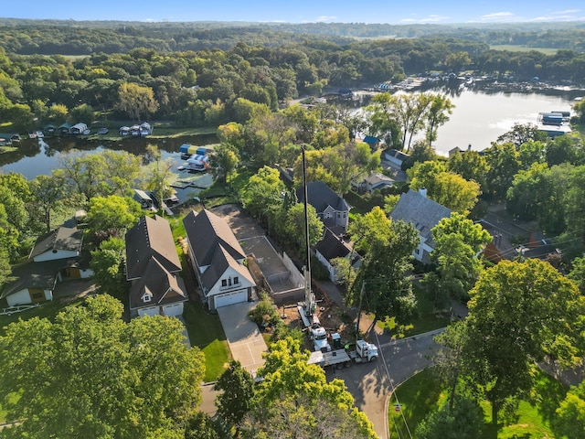 drone / aerial view featuring a water view and a residential view