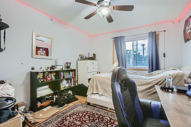 bedroom featuring ceiling fan and hardwood / wood-style flooring