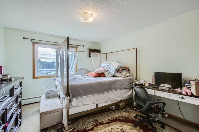 carpeted bedroom with a textured ceiling and a baseboard radiator