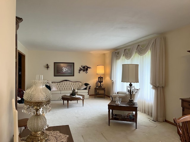 living room with plenty of natural light and light colored carpet