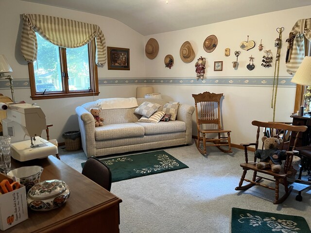 carpeted living room featuring lofted ceiling