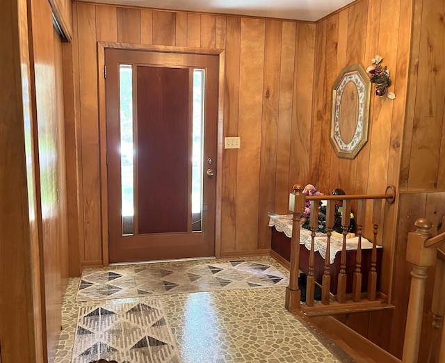 foyer entrance with wood walls