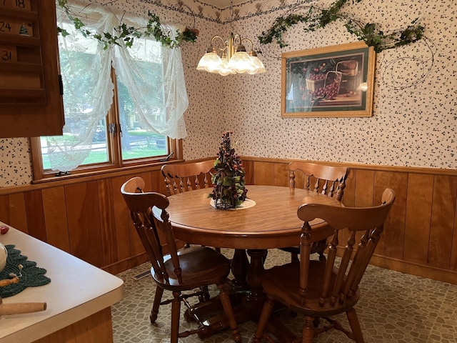 dining space featuring a notable chandelier