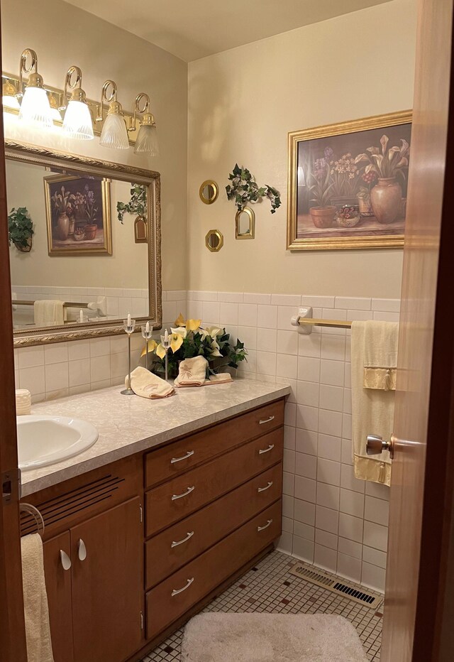 bathroom featuring vanity, tile walls, and tile patterned flooring