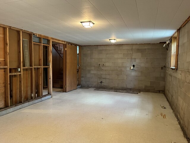 basement featuring light tile patterned flooring