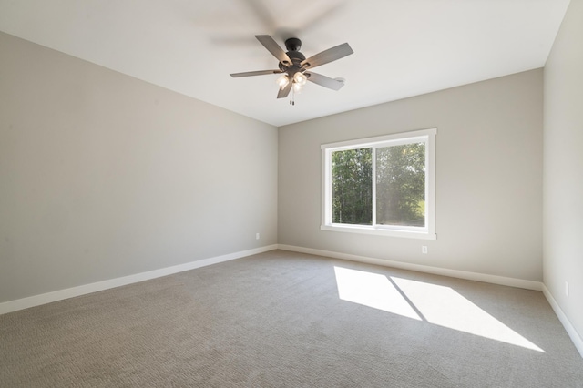 empty room with carpet and ceiling fan