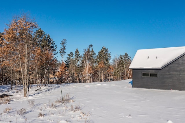 view of yard covered in snow