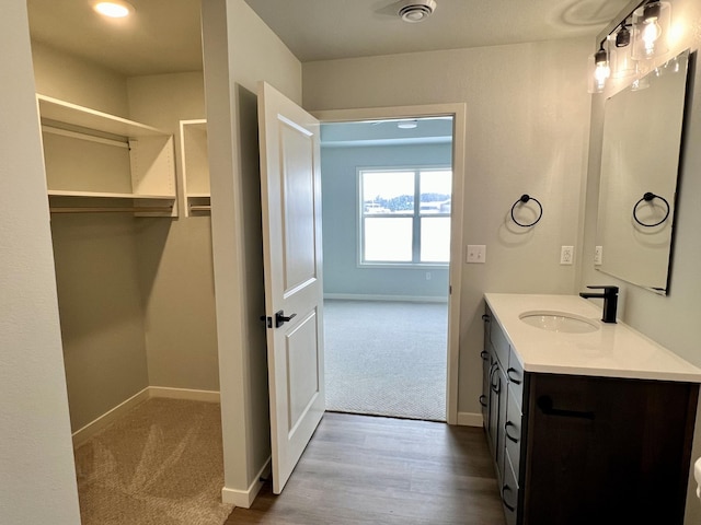 bathroom featuring wood-type flooring and vanity